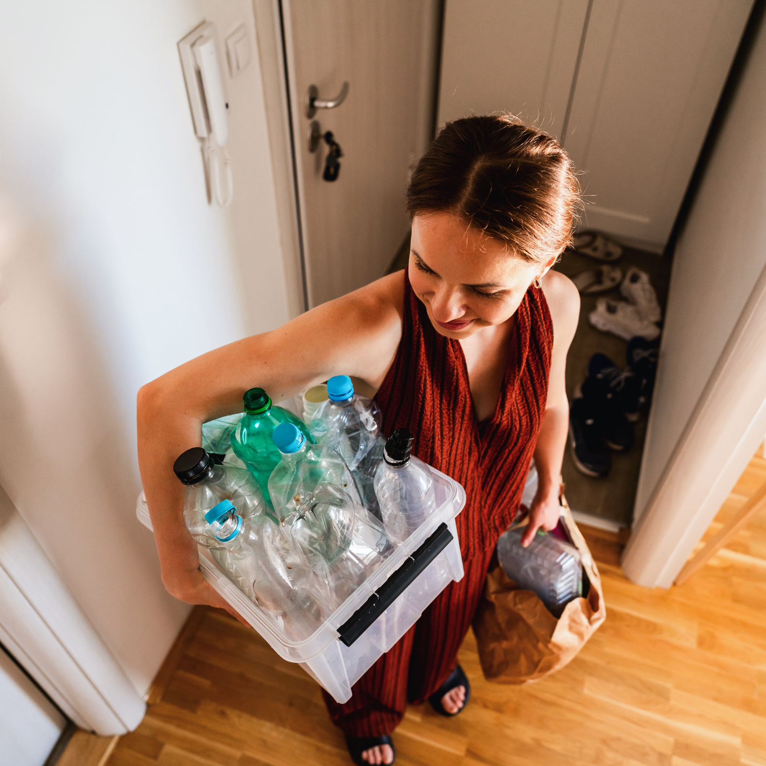 Woman Carrying Plastic